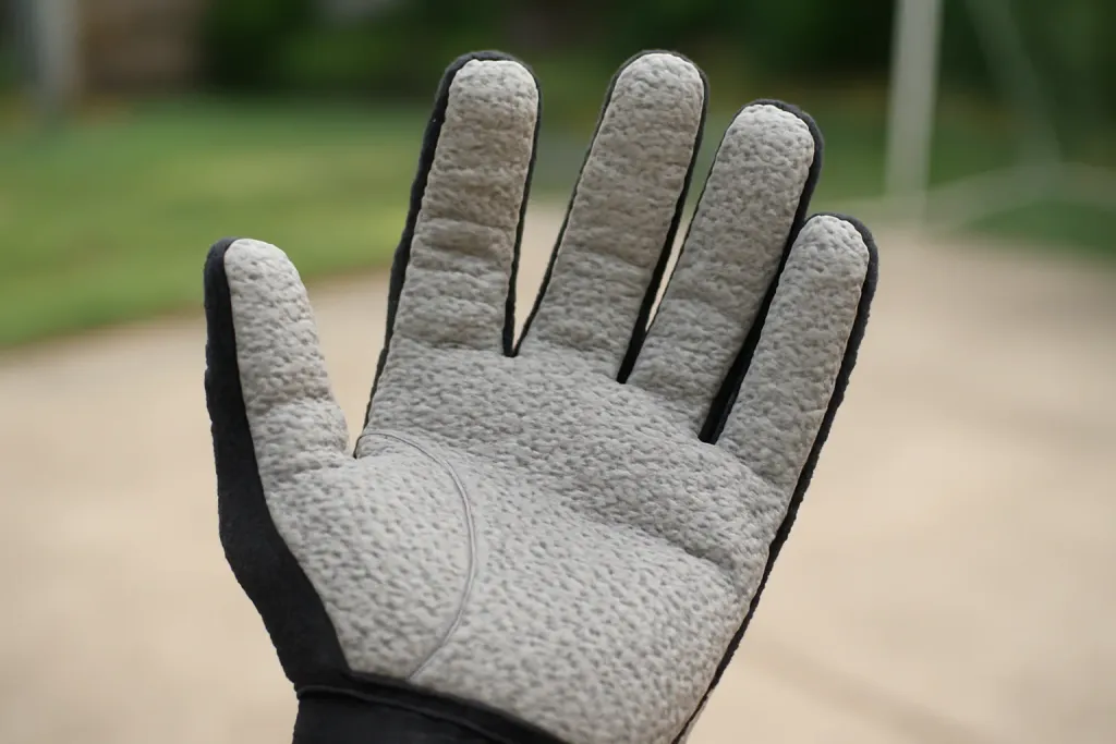 Editorial photograph of a close-up of an unbranded racquetball glove's grip palm material